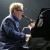 Elton John performing at the piano